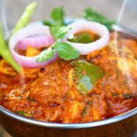 Kadai Chicken · Chicken cooked in thick gravy with capsicums, onions and Indian spices