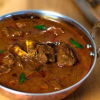 Home Style Lamb Curry · Savory lamb cooked in a cumin, ginger, garlic, and tomato base.