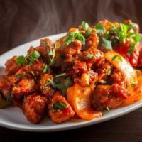 Chilli Chicken-Dry · Battered chicken fried and tossed with sweet and spicy sauce.