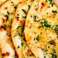 Garlic & Cheese Naan · Flat bread sprinkled with crushed garlic & cheese and baked in tandoor oven.