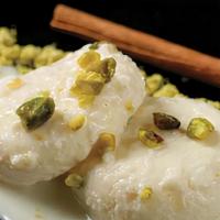 Ras Malai-2pcs · Farmer’s Ricotta cheese  discs, soaked in thick sweetened milk, flavored with cardamom and d...