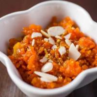Carrot Halwa · Grated carrots cooked gently in milk and generously sprinkled with nuts. Served warm.