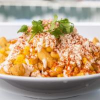 Elote Fries · French Fries topped with cotija cheese, mayo, sour cream, corn, chili pepper and cilantro.