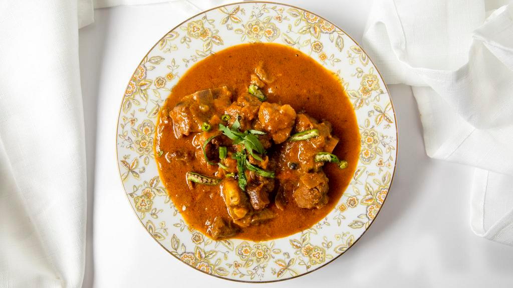 Lamb Curry · Lamb with curry cooked in fresh spices served with rice or naan.