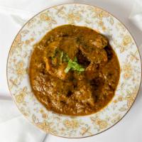 Palak Lamb · Cooked lamb with spinach fresh spices served with rice or naan.