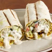 Chicken Shish Taouk  Wrap · Cubed chicken marinated with our special Mediterranean spices, wrapped with lavash bread wit...