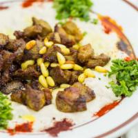 Feta with Meat · Hummus mixed with pita bread, topped with seasoned coarse lamb, garlic, lemon juice and oliv...