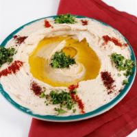 Hummus · Crushed garbanzo beans, blended with tahini sauce, olive oil and lemon juice.