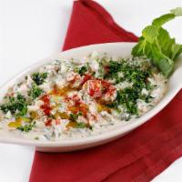 Jerusalem Salad · Tahini sauce, tomato, cucumber, parsley with olive oil and lemon.