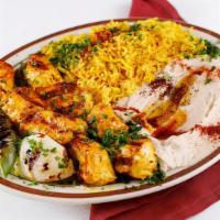 Chicken Shish Taouk Kabab · 2 skewers or seasoned grilled chicken with grilled onion, tomato and bell pepper. Served wit...