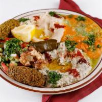 Vegeterian Combo · Combination of falafel, hummus, ful, dolma, baba ghanoush, Arabic salad, eggplant and caulif...