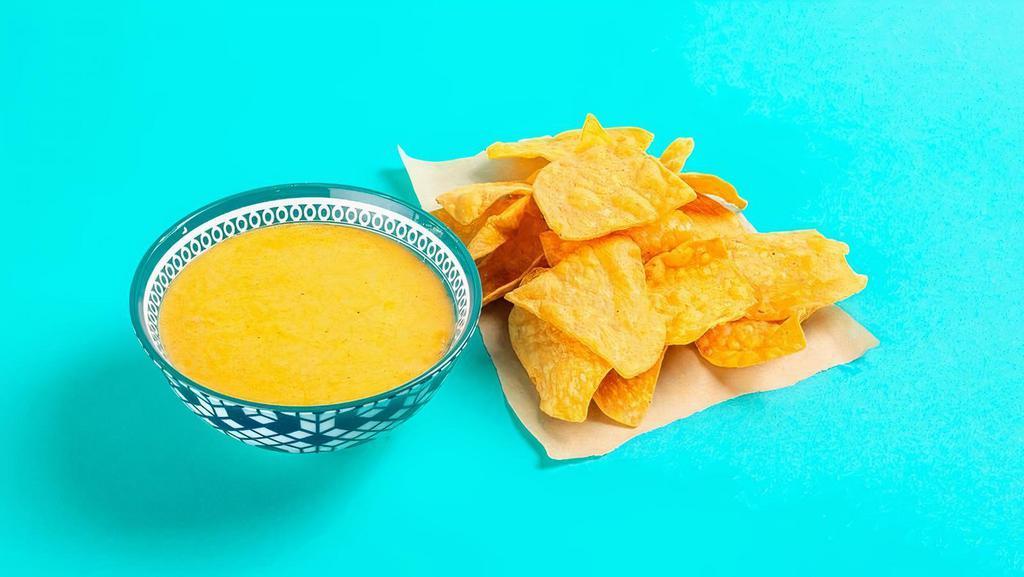 Chips + Queso · Crispy tortilla chips served with warm house-made queso sauce. Gluten-friendly. .