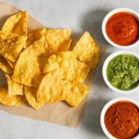 Chips + Salsa · Crispy tortilla chips with a salsa trio. Gluten-friendly. . Roja (mild) a blend of tomatoes,...