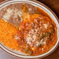 Huevos Ranchero · Two eggs over easy with ranchero sauce. Served with rice and beans . Your choice of corn or ...
