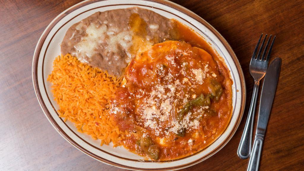 Huevos Ranchero · Two eggs over easy with ranchero sauce. Served with rice and beans . Your choice of corn or flour tortillas.