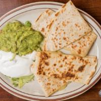 Quesadillas · Choice of chicken, ground beef, pork or cheese. Flour tortilla with melted Monterey Jack che...