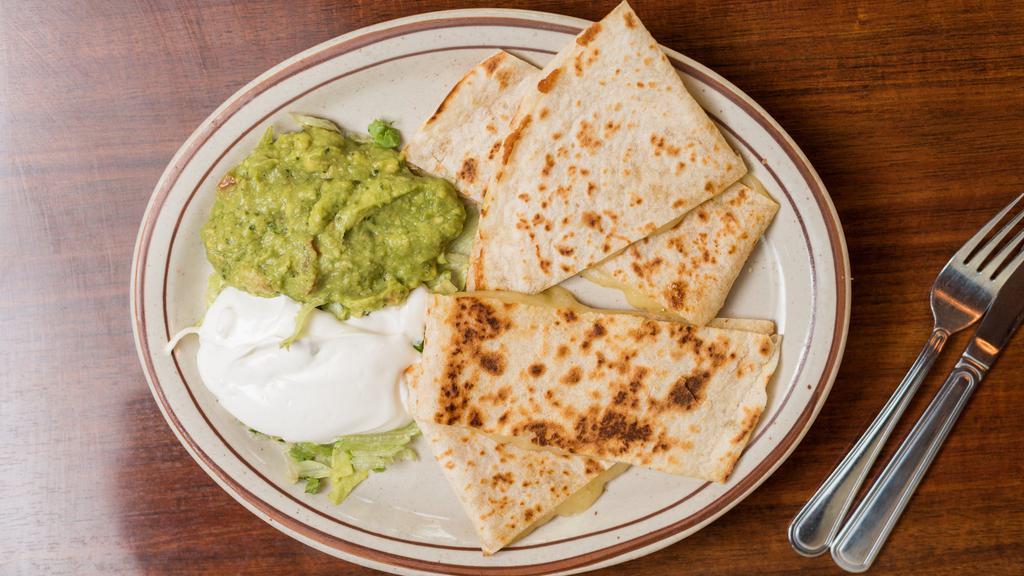 Quesadillas · Choice of chicken, ground beef, pork or cheese. Flour tortilla with melted Monterey Jack cheese with sides of lettuce, sour cream and guacamole.
