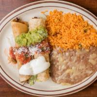 #2 Tostada and Flauta Combo · Served with rice and beans.