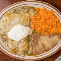 Enchiladas (2) · Your choice of chicken, ground beef or cheese. They are topped with cotija cheese and a spec...
