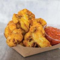 Fried Cauliflower · Cauliflower florets, beer battered & fried to a crisp golden brown and tossed with Dal seaso...
