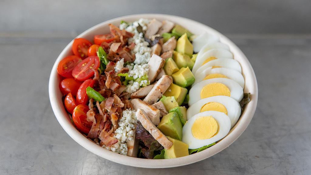Cobb Salad · Seasonal lettuce tossed with lemon-Dijon vinaigrette & topped with chicken, Zoe's bacon, tomatoes, organic cage-free hard-boiled egg, Point Reyes blue cheese & avocado.