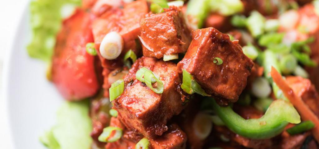 Chili Paneer · Paneer deep fried with batter and sautéed bell peppers, manchurian sauce, ketchup, green onions.