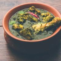 Saag Chicken · Boneless chicken cooked in clay oven and simmered in spinach puree.