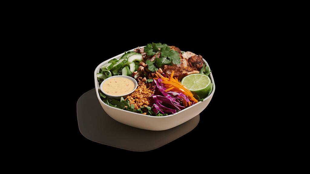 Crispy Rice Bowl · blackened chicken, raw carrots, shredded cabbage, cucumber, cilantro, toasted almonds, crispy rice, warm wild rice, arugula, fresh lime squeeze, spicy cashew dressing