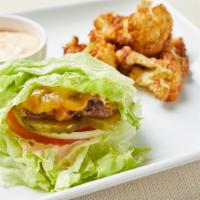 Keto Lettuce Wrapped Burger · Lettuce wrapped fresh grilled seasoned beef patty, cheddar, tomato, onion and pickles. Serve...