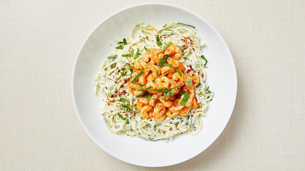 Keto Shrimp Alfredo Zoodle · Pan roasted zucchini noodles served with homemade Alfredo sauce and spicy garlic shrimp. Gluten-free.