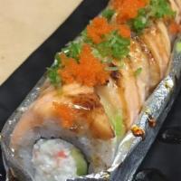 Lion King · California roll topped with salmon and baked with creamy mayo, masago, scallion, Unagi sauce.