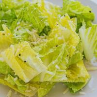 Caesar Salad · Romaine hearts tossed with olive oil & garlic dressing, topped with romano cheese.
