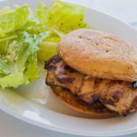 Grilled Chicken Sandwich · Served on an onion roll with your choice of french fries or caesar salad.
