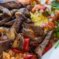 Steak Fajitas · Served with Spanish rice and your choice of black or navy beans, corn or flour tortillas, so...