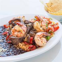 Steak & Shrimp Fajitas · Served with Spanish rice and your choice of black or navy beans, corn or flour tortillas, so...