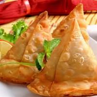 Samosa (2pc) · Veggie turnover, stuffed with potatoes, green peas, herbs and spices, served with chutney.