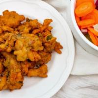 Vegetable Pakora · Vegetables dipped in a spicy batter and deep fried.