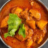 Chicken Curry · Chicken cooked in a blend of spices.