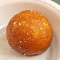 Gulab Jamun · Caramelized milk balls in sugar syrup.