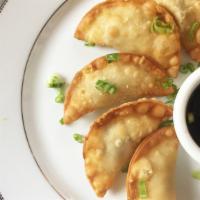 Deep Fried Beef Dumplings · Ground Beef, Shredded Carrot, Chive, Minced Garlic and Giger, with Soy Dipping Sauce