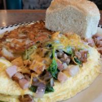Joe'S Hobo Omelette · Ham, link sausage, bacon, jack cheese, cheddar cheese, spinach & onion.