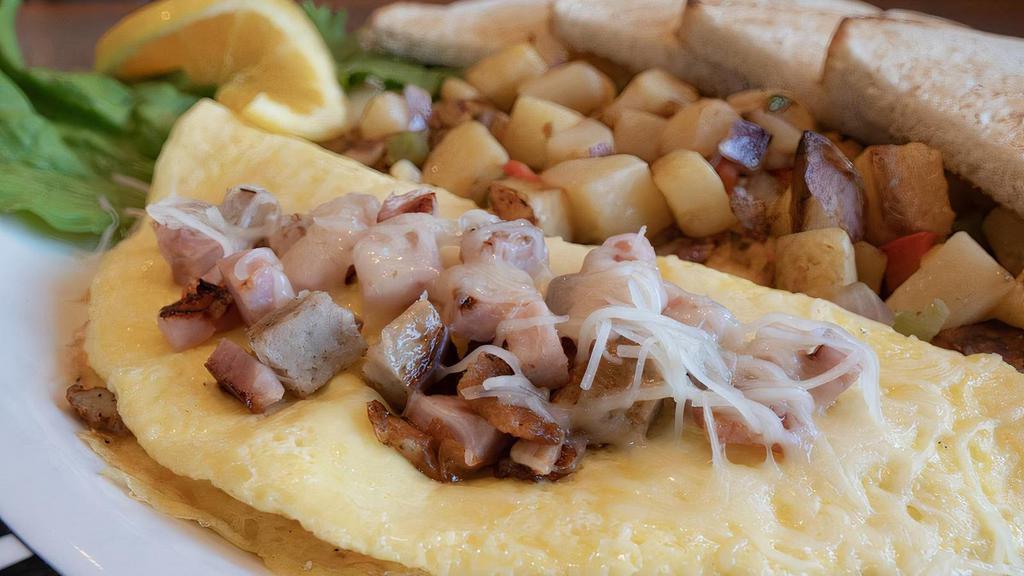 Bruce'S Meat Lover'S Omelette · Ham, bacon, link sausage & jack cheese.