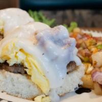 Southern Scramble · Split biscuit covered with 2 sausage patties, 2 scrambled eggs & country gravy..