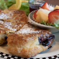 Stuffed Blackberry French Toast · Our fruit filled bear claw, dipped in egg batter* & griddled to perfection.  Served with fre...