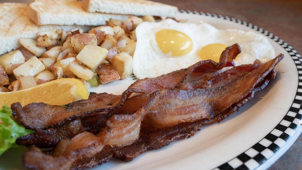 Thick-Cut Smoked Bacon & Eggs · Our hickory smoked bacon is some of the best you’ll ever have.