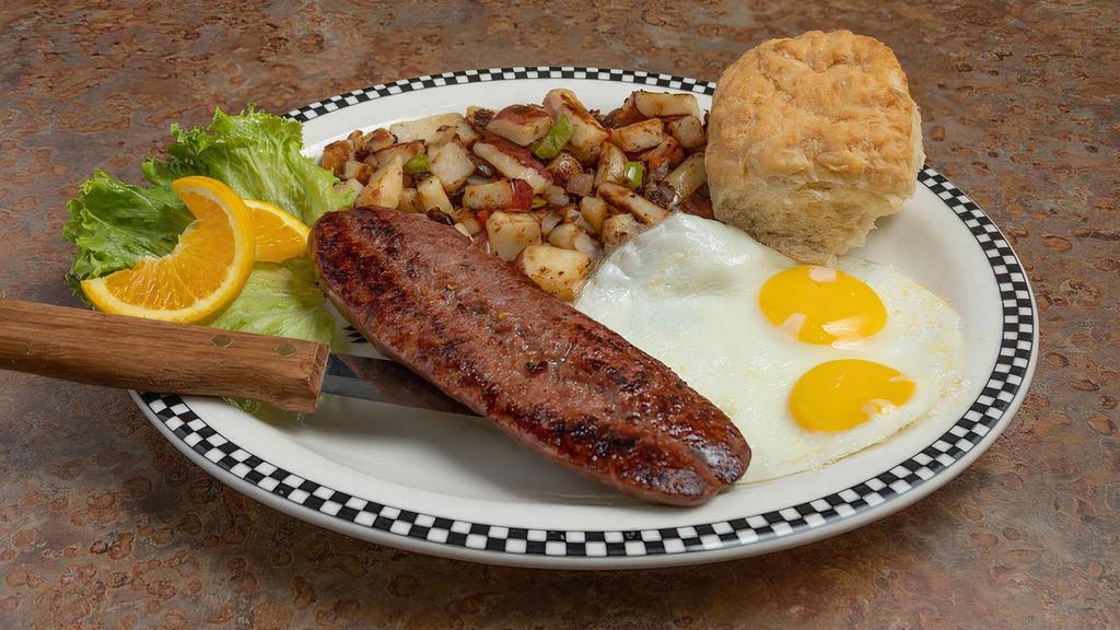 Hot Link & Eggs · A spicy 5.3 oz Texas-style beef & pork sausage hot link with two eggs, choice of side and a biscuit.