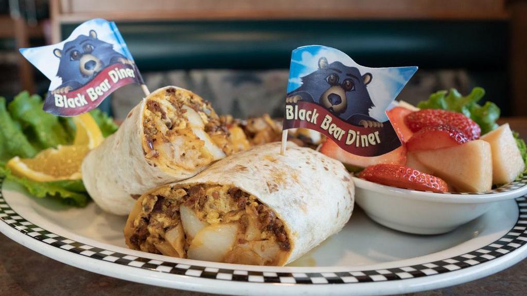 Breakfast Burrito · Chorizo sausage, country potatoes, scrambled eggs, cheddar cheese, onion, & cilantro all wrapped in a warm flour tortilla. Served with housemade salsa and fresh fruit.