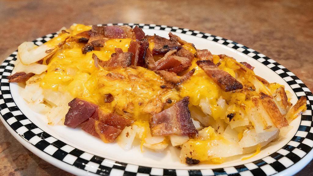 Side Of Loaded Potato · Your choice of potato topped with diced bacon and shredded cheddar cheese!