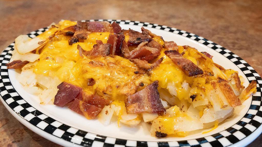 Side of Loaded Potato · Your choice of potato topped with diced bacon and shredded cheddar cheese!