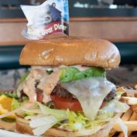 California Burger · A 6 oz. all beef patty built on a golden brioche bun, shredded lettuce, tomato, diced red on...